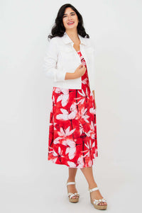 Model wearing red floral tank dress paired with a white jacket