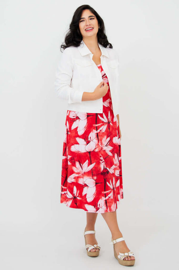 Model wearing red floral tank dress paired with a white jacket