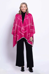 Woman wearing a reversible geometric wrap in fuchsia, full front view