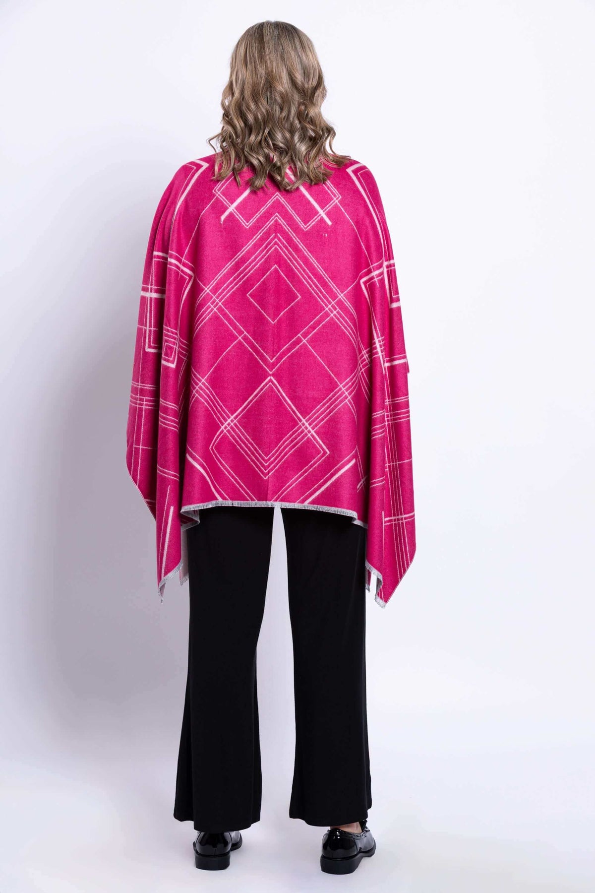 Back view of a reversible geometric wrap in fuchsia with geometric line pattern