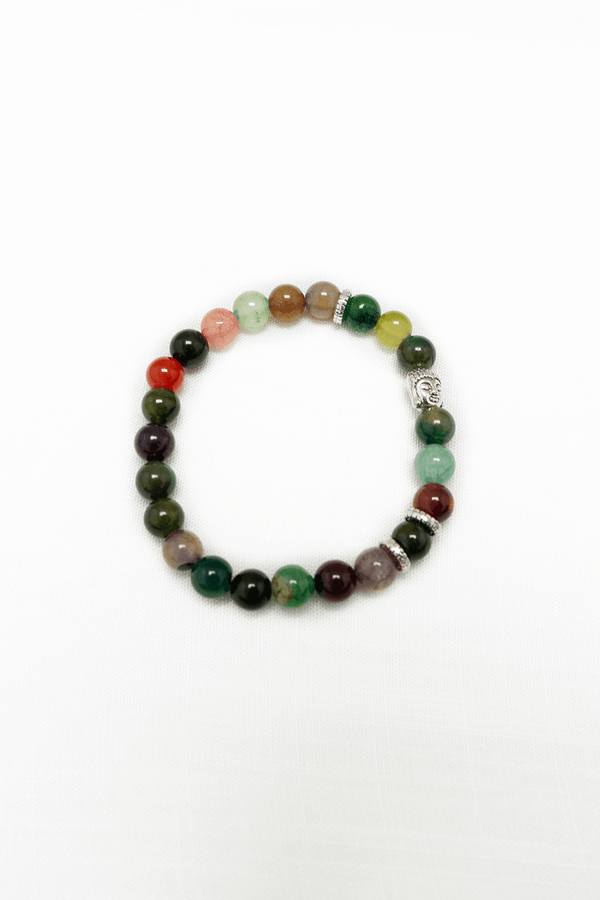 Multi-colored beaded chakra bracelet with a silver Buddha charm on a white background