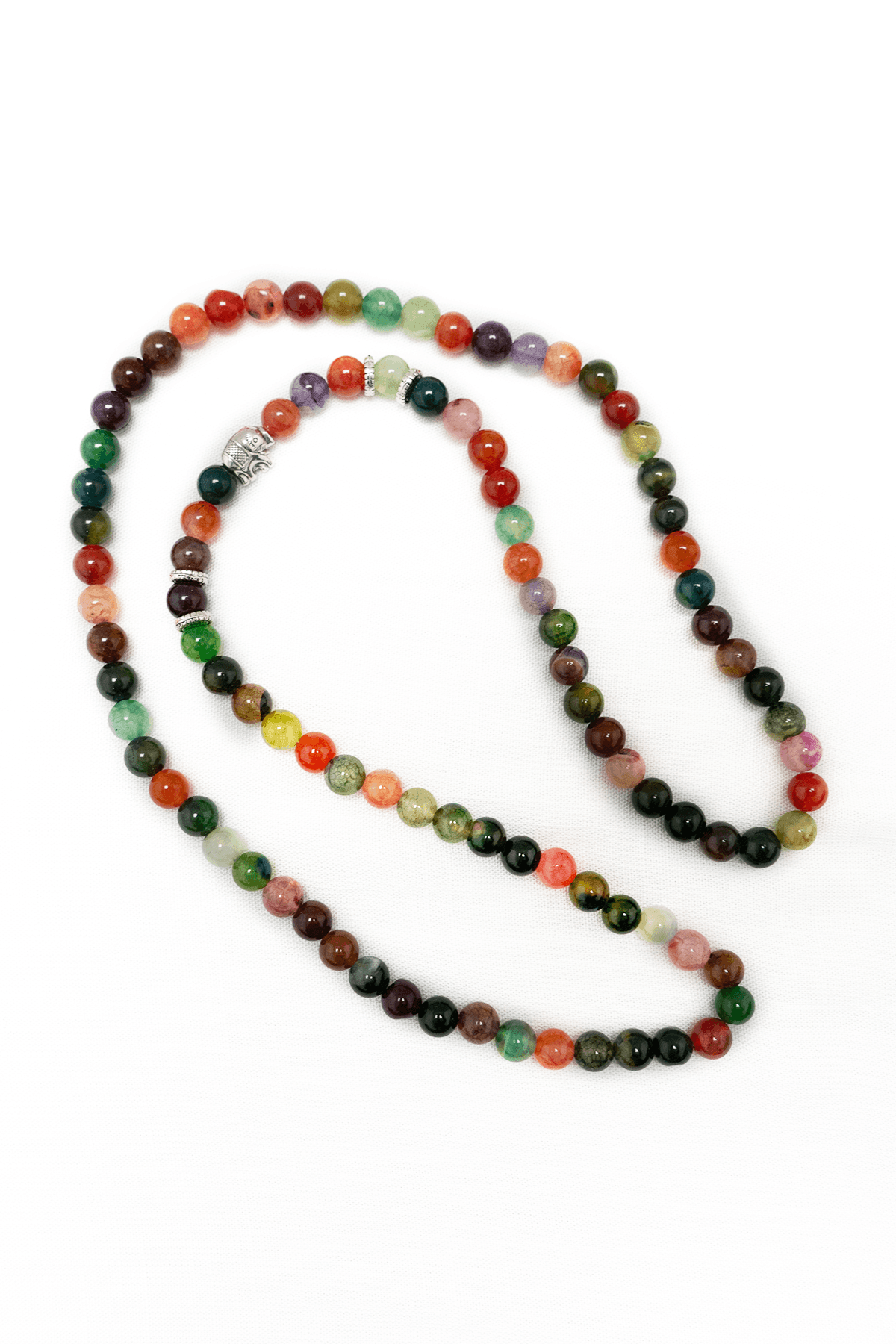 Colorful gemstone beaded bracelet with rhodochrosite and silver accent on white background