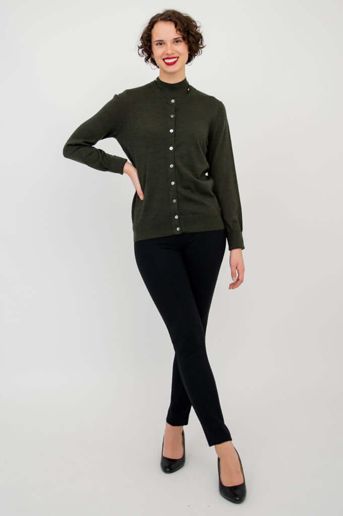 Model layering the Rita Merino Wool Sweater with a matching button-up cardigan