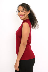 Profile shot of a dark red sleeveless knit top showing slim fitting silhouette and side seam detail.