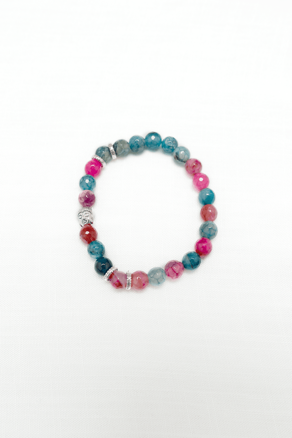 Rose Quartz Rhodochrosite beaded bracelet with blue and pink stones and silver Buddha charm on white background