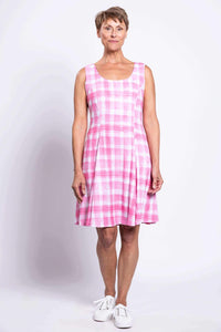 Full front shot of woman in pink plaid sleeveless dress standing straight