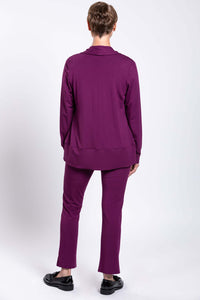 Back view of woman modeling Sarina Pant in plum bamboo fabric