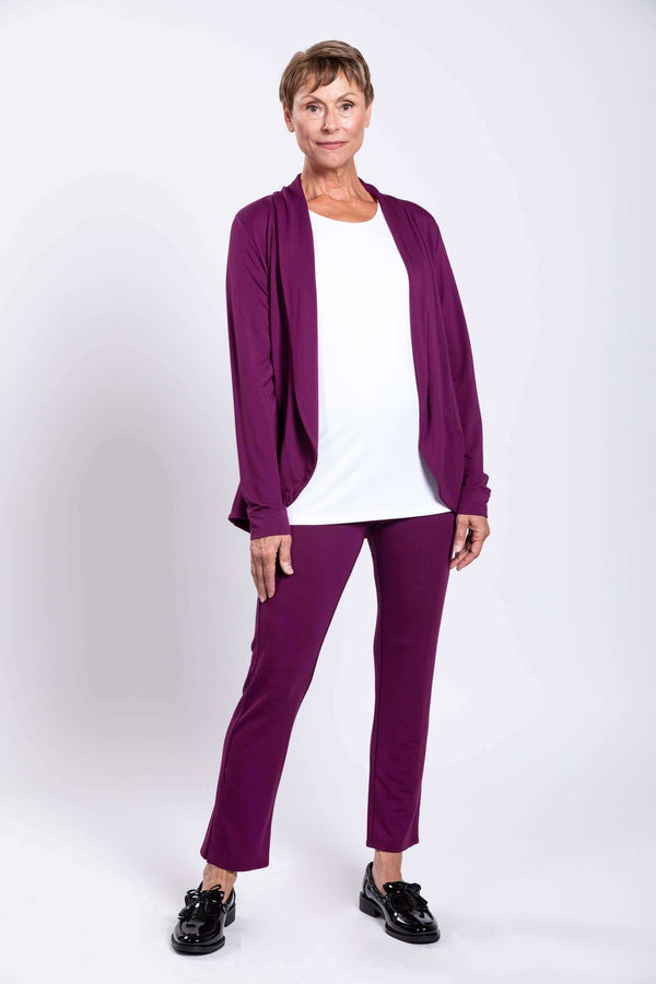Front view of woman wearing Sarina Pant in plum bamboo with white top