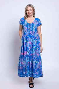 Front view of the Sharpie Dress showing side pockets and floral print details