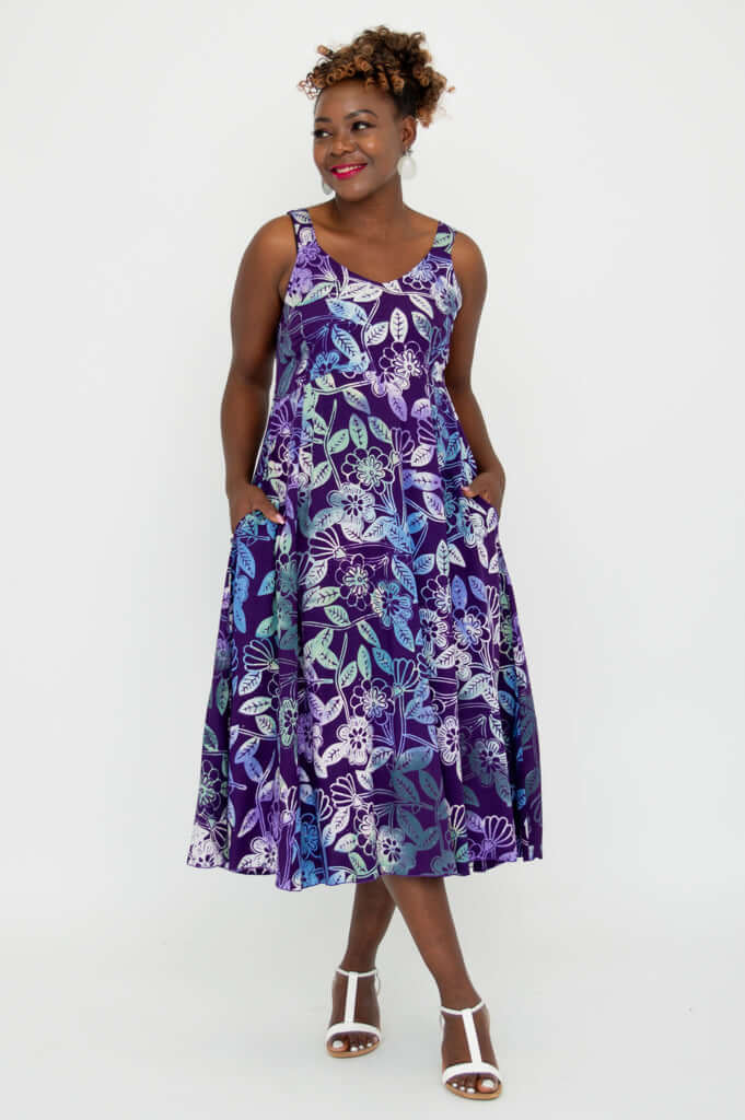 Model styling Shauna violet floral dress hands in both pockets