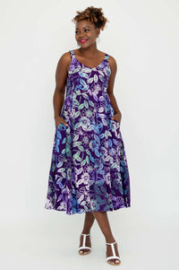 Model styling Shauna violet floral dress hands in both pockets