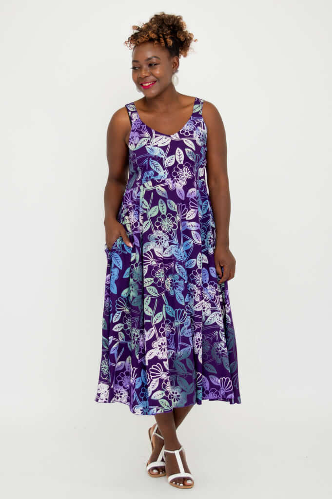 Model showing side angle of Shauna midi dress in violet floral print