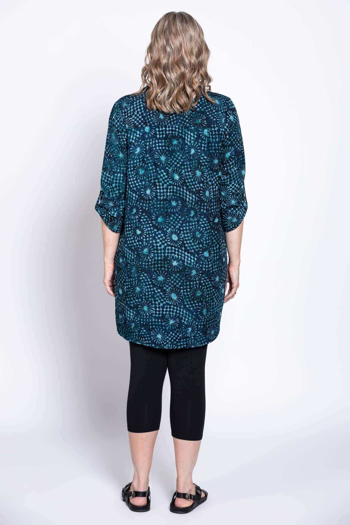 Back view of the Shirley blouse showing blue batik pattern and 3/4 sleeves
