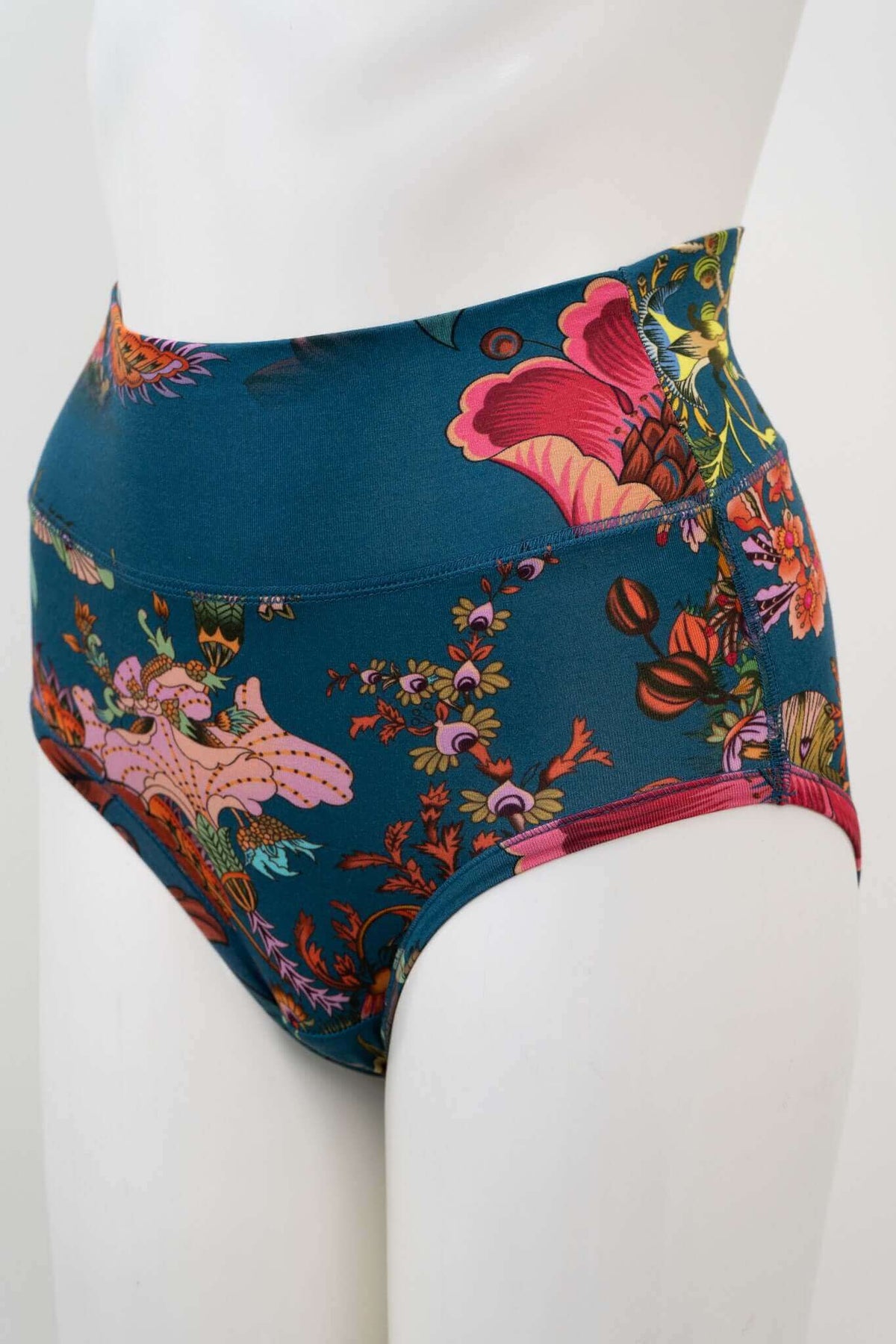 Side angle of high-waist brief showcasing colorful floral pattern