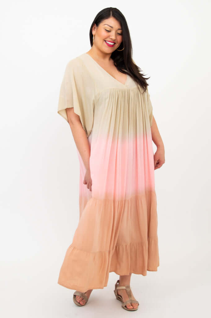 Side view of model in beige to blush ombre maxi dress, showing sleeve detail