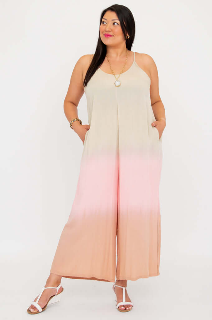 Model looking sideways in an ombre jumpsuit with v-neckline and pockets