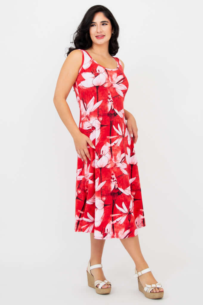 Side angle of model in red floral sleeveless A-line dress