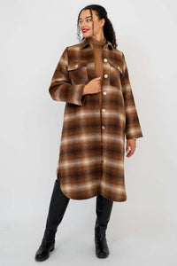 Side front view of model showcasing the plaid coat's relaxed silhouette