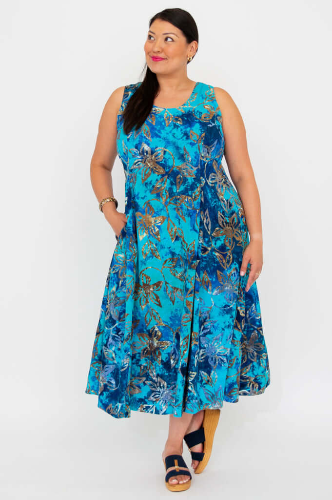 Model in a blue floral A-line midi dress with a side-facing pose