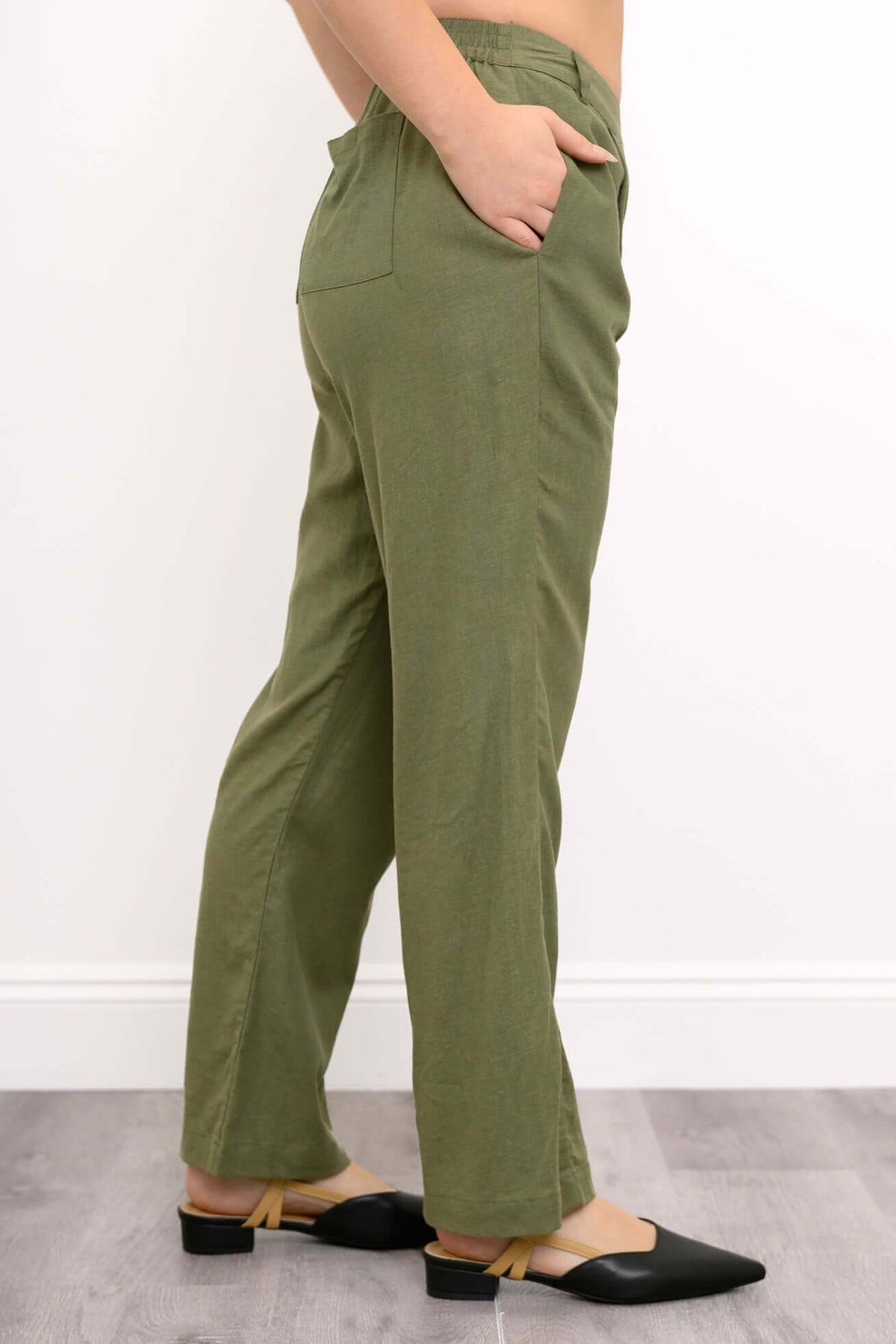 Side view of model featuring elasticized back waistband and side pocket of Melodie Pant