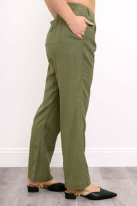 Side view of model featuring elasticized back waistband and side pocket of Melodie Pant