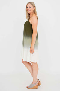 Woman showing side profile in an olive ombre mini dress with adjustable straps