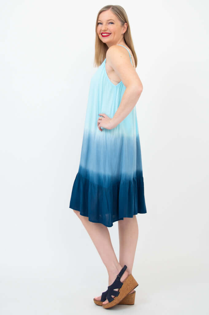 Side profile of woman in ombre aqua spaghetti strap sundress