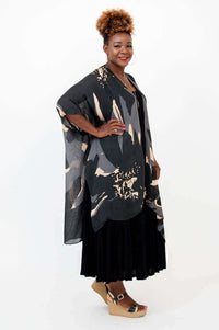 Side view of Darcy kimono wrap showing flowing hemline and sleeve details