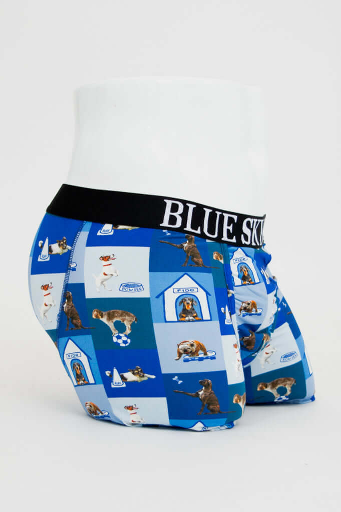 Side view of men's boxer briefs with playful dog and doghouse pattern, BLUE SKY GUY waistband