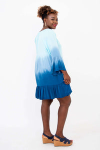 Side view of the Ellie Dress showing ruffle sleeve and tiered flounce hem in blue ombre
