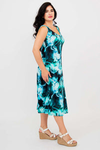Side view of the Evangelina tank dress in an aqua marble pattern on a woman