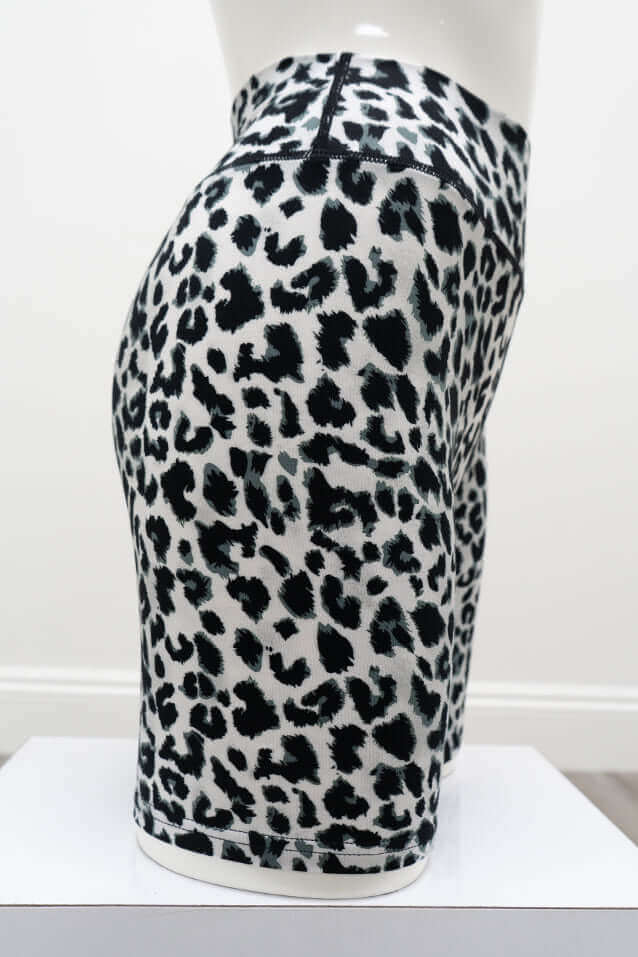 Side view of black and white leopard print bamboo shorts on a mannequin