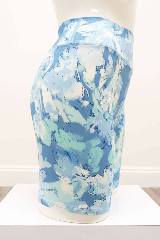 Side view of Hallie Bamboo Shorts in watercolor blue floral pattern on a mannequin