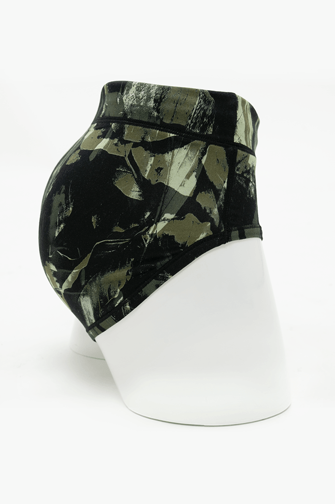 Side view of La Gaunche Bamboo Brief in olive camo print on mannequin