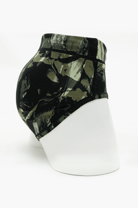Side view of La Gaunche Bamboo Brief in olive camo print on mannequin