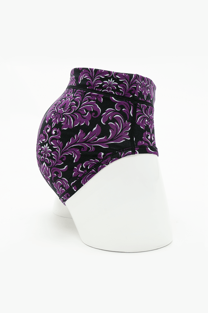 Side view of La Gaunche bamboo brief in purple and black damask pattern
