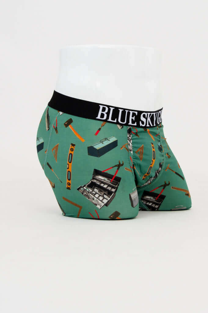 Side angle of Middle Man men's bamboo underwear with colorful tool pattern and branded waistband