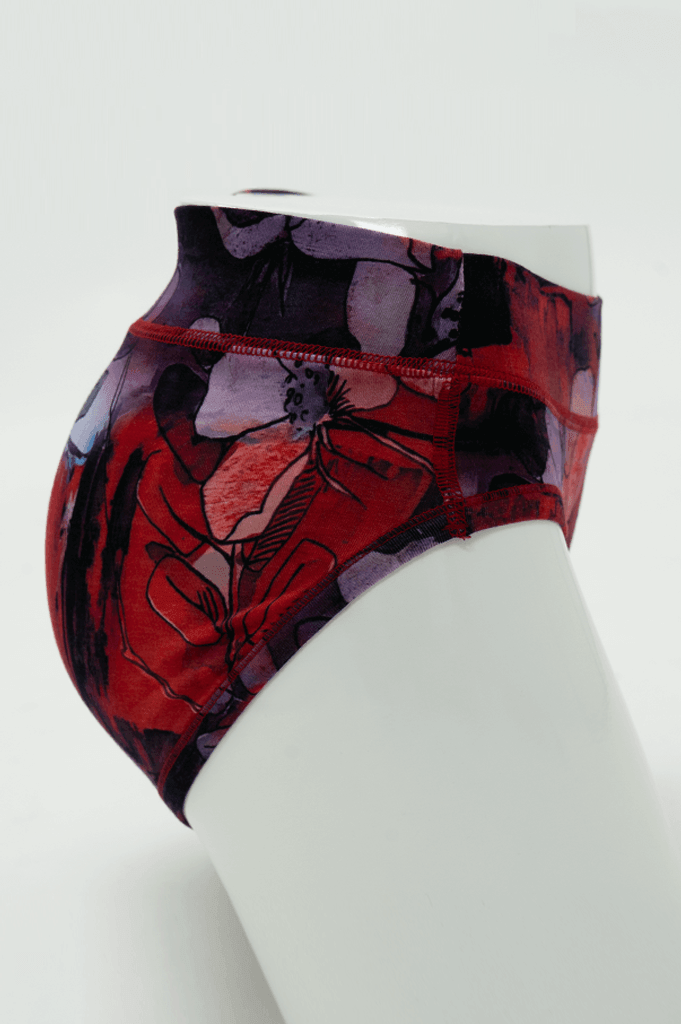 Side view of bamboo hipster underwear in red watercolor floral print on mannequin