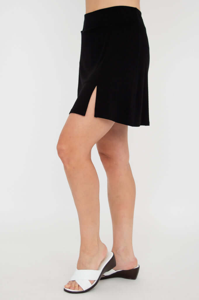 Side view of black Melly skort showing high waist and side slit