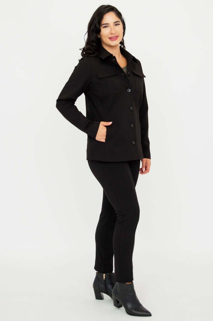 Side view of a woman wearing a black shirt-collar jacket