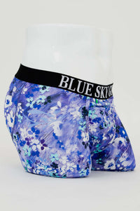 Angled side view of blue and white floral bamboo boxer briefs featuring the BLUE SKY GUY waistband