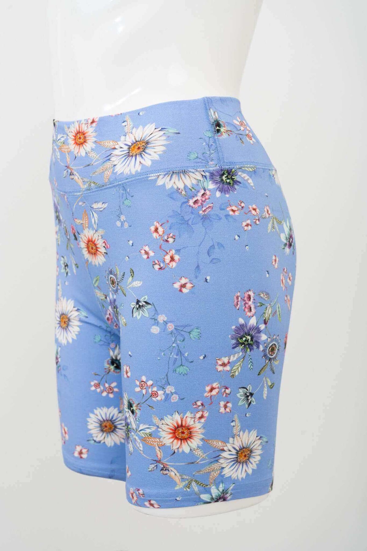 Side view of blue bamboo floral shorts on a mannequin