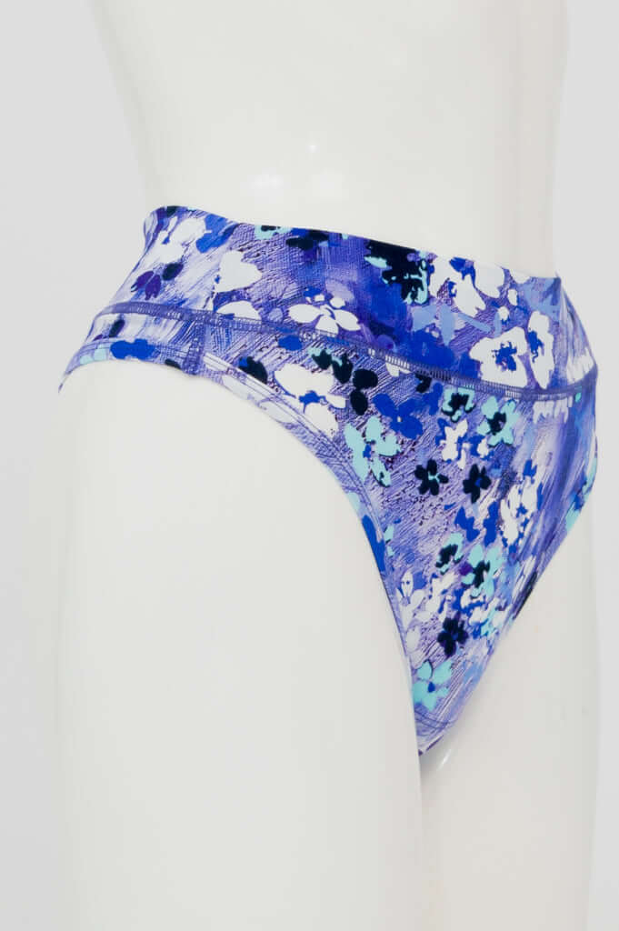 Side view of blue floral print high rise thong underwear on mannequin