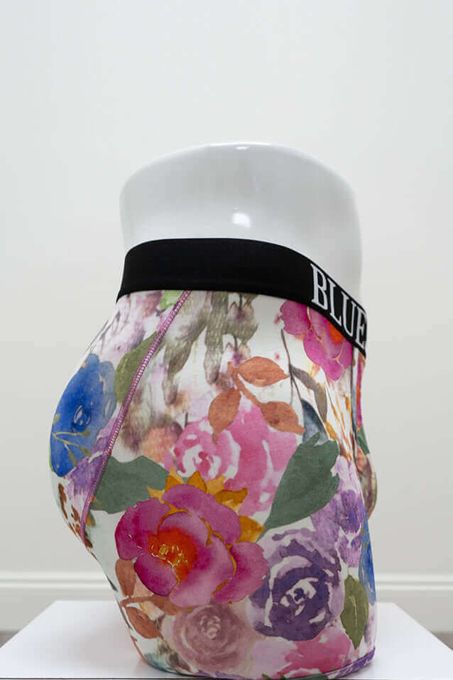 Side view of floral print men's bamboo boxer briefs on mannequin