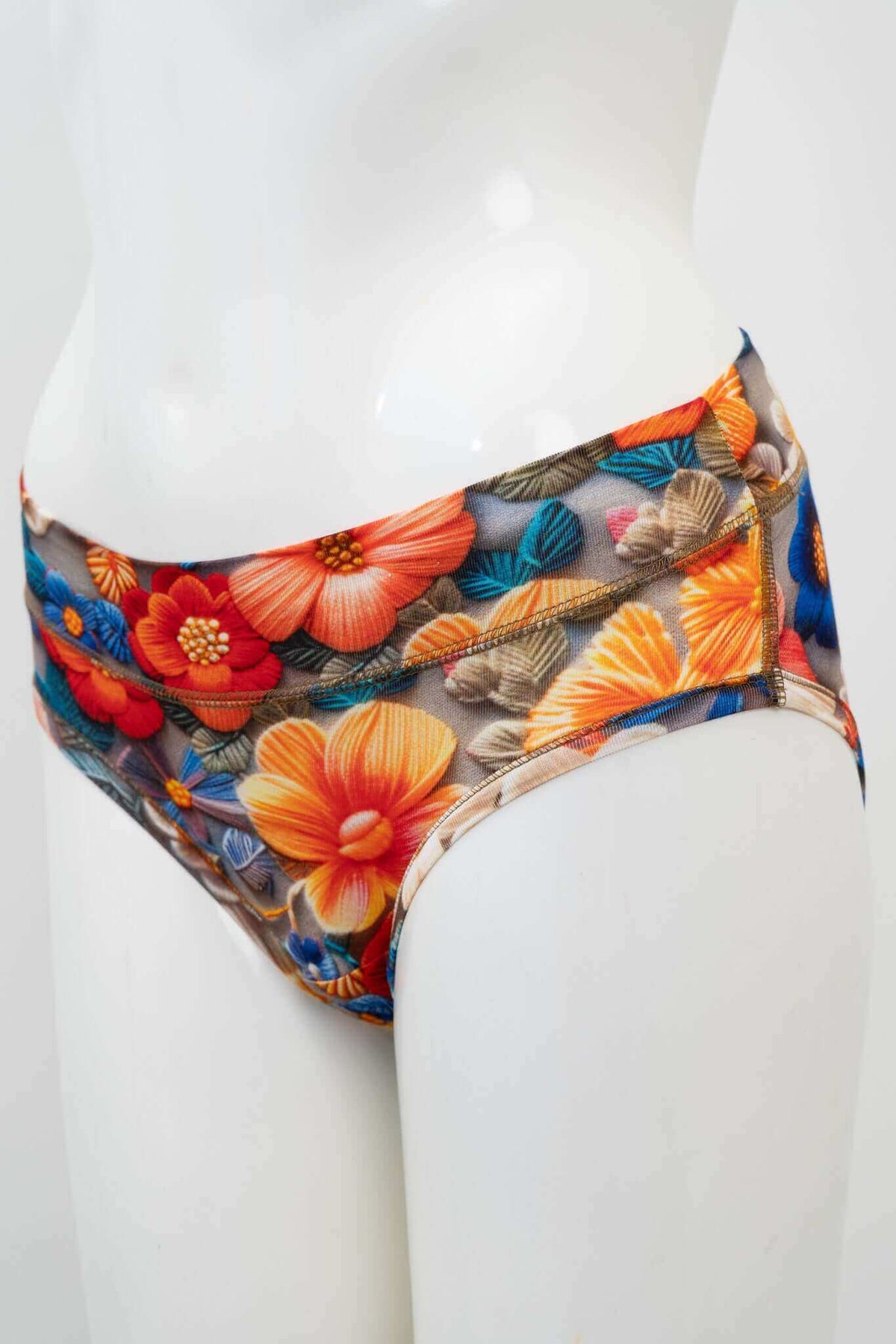 Side view of mesh floral briefs on mannequin