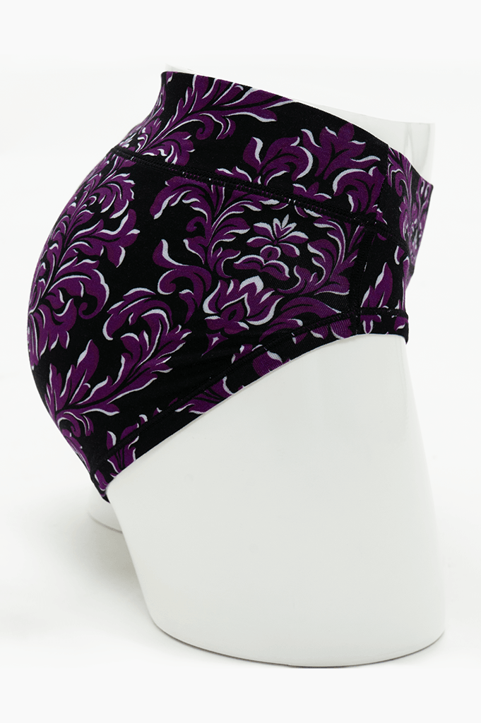 Side view of purple and black flourish print hipster underwear on mannequin
