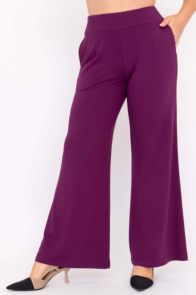 Side angle view of purple wide leg bamboo pants with a high waistband