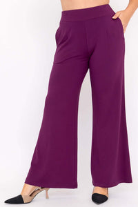 Side angle view of purple wide leg bamboo pants with a high waistband