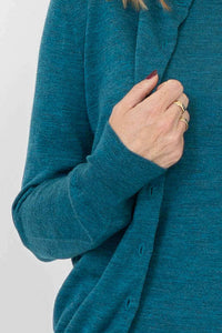 Detail of sleeve and ribbed cuff on teal button-up merino wool cardigan