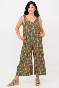 Model wearing sleeveless floral bamboo linen jumpsuit with cropped wide legs front view